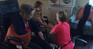 an elderly woman receiving a arm massage from a massage therapist